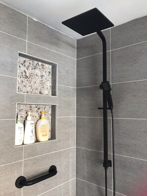 Shower, hair dryer, towels, soap