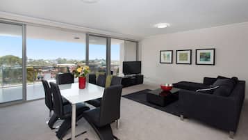 Executive Apartment | Living area | Flat-screen TV, DVD player