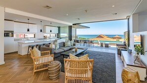 A modern kitchen with white cabinets and a built-in microwave. - Zimbali by Euphoric, Zimbali Coastal Resort, Ballito (Ballito)
