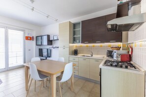 Apartment, 2 Bedrooms, Smoking, Balcony | Private kitchen | Coffee/tea maker, electric kettle, dining tables