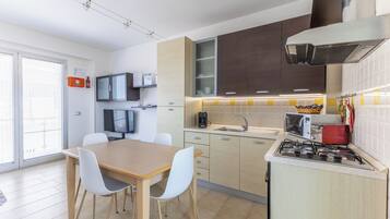 Apartment, 2 Bedrooms, Smoking, Balcony | Private kitchen | Coffee/tea maker, electric kettle, dining tables