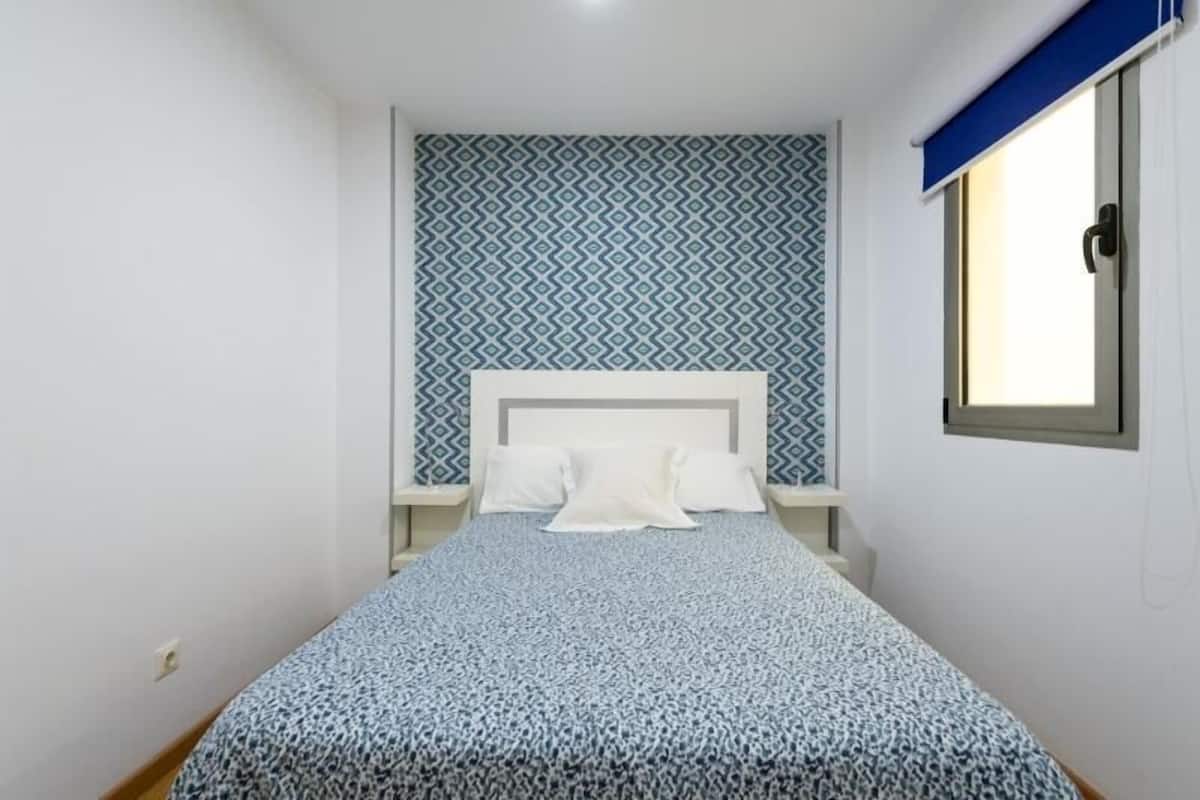 Apartamento familiar | Ropa de cama de alta calidad y espacio para trabajar con un portátil