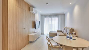 Apartment, 1 Bedroom | Living area | 32-inch flat-screen TV with digital channels, TV