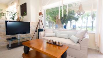 Villa, 4 Bedrooms | Living area | Flat-screen TV, fireplace, computer