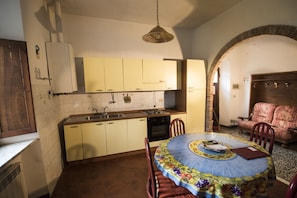 Enjoy meals in this kitchen with an oven, sink, and central island.