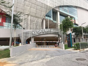 A modern building with a prominent entrance labeled "KL Gateway Residences."