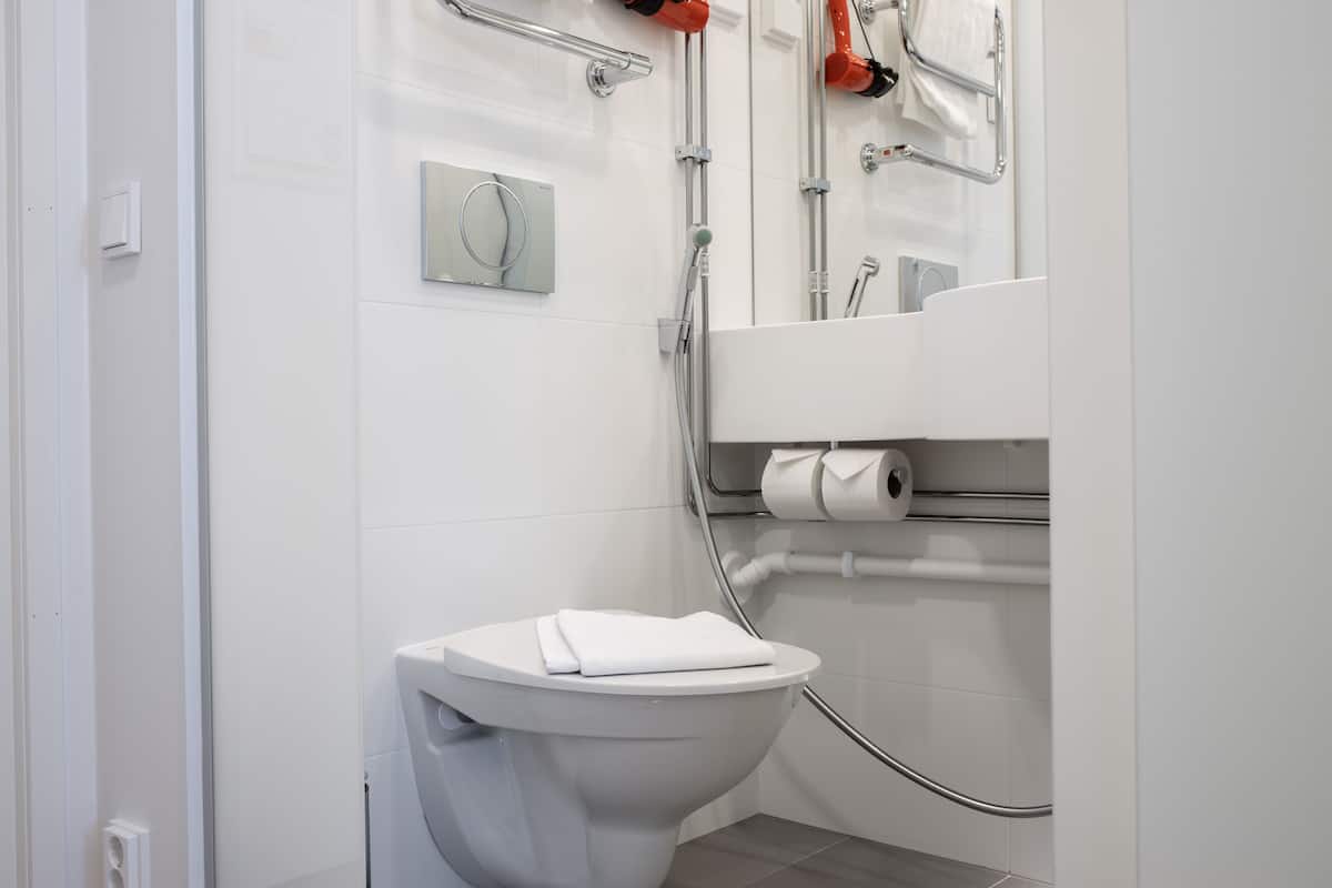 standard single room | bathroom | shower, rainfall showerhead, hair dryer, heated floors