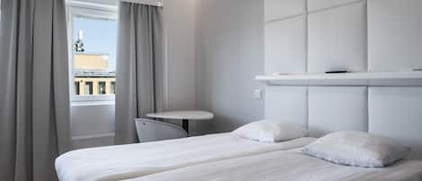 Laptop workspace, blackout curtains, soundproofing, free WiFi