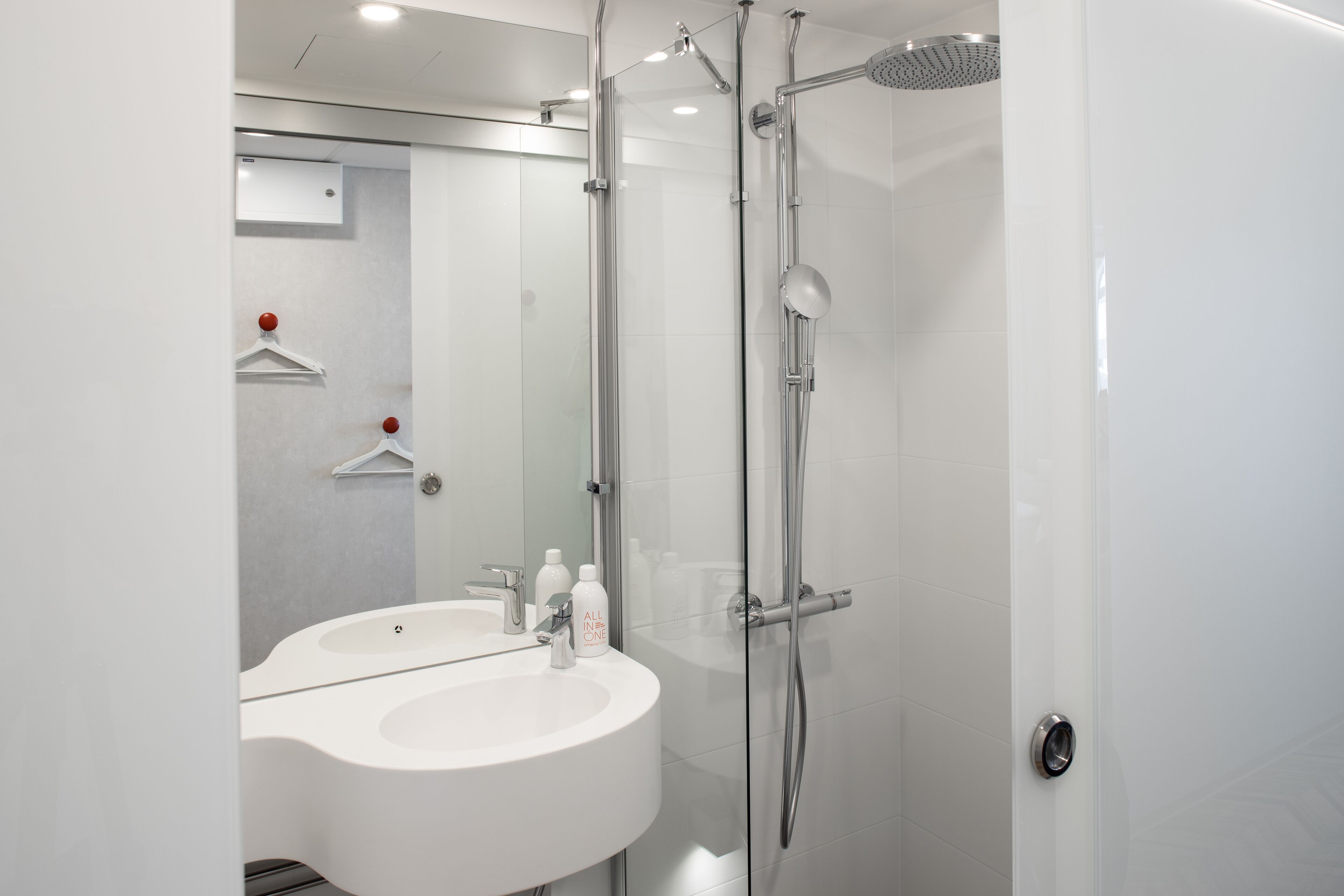 standard single room | bathroom | shower, rainfall showerhead, hair dryer, heated floors