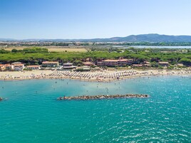 On the beach, sun loungers, beach umbrellas, beach bar
