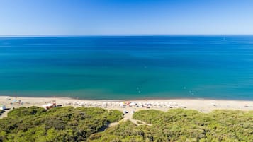 Private beach, black sand, sun-loungers, beach umbrellas