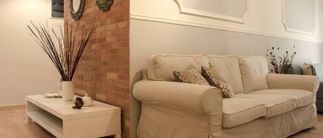 Apartment, 3 Bedrooms | Living room | Flat-screen TV