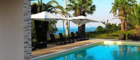Seasonal outdoor pool, open 7:30 AM to 9:00 PM, sun loungers