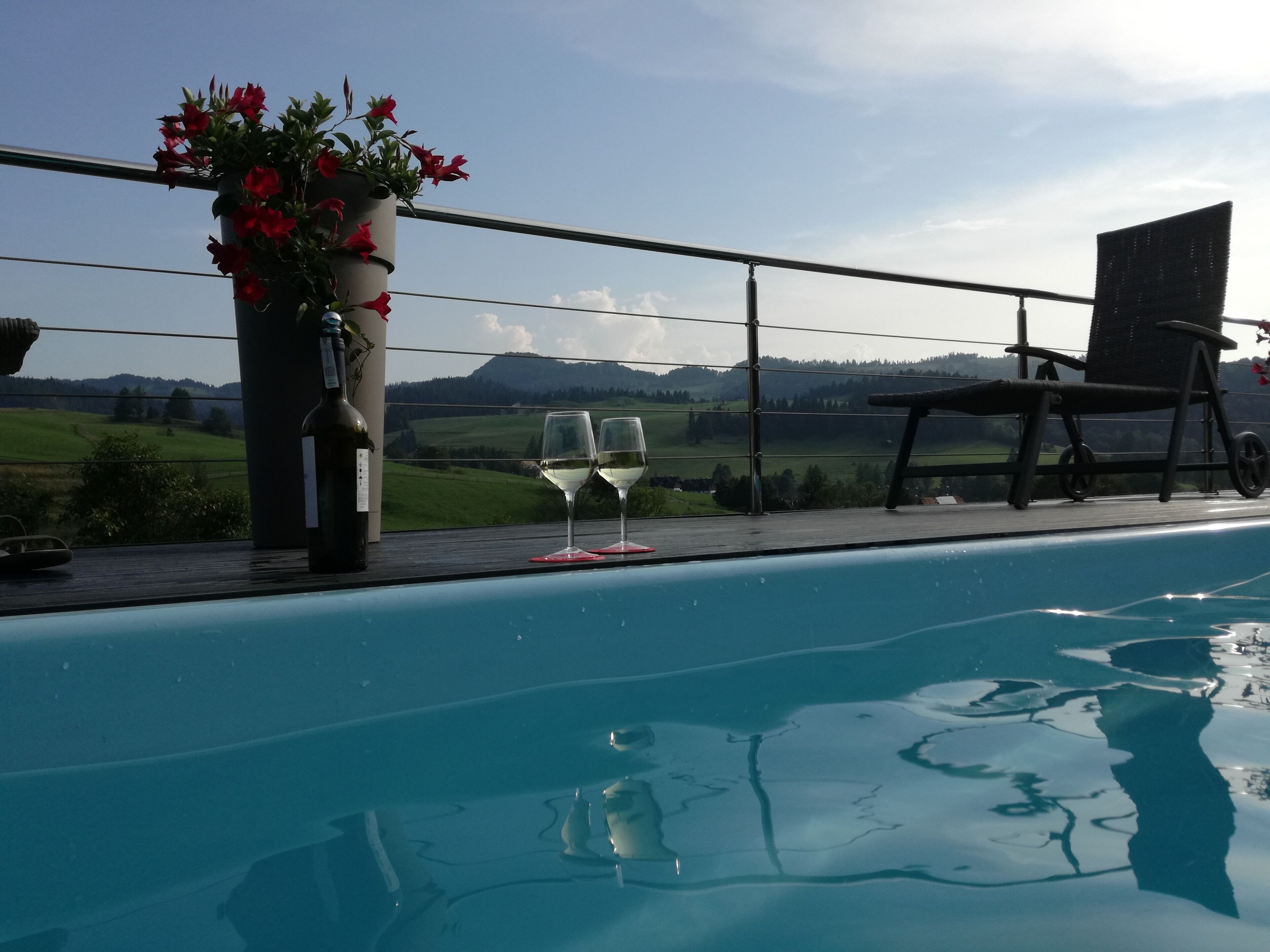 Seasonal outdoor pool, pool umbrellas, pool loungers