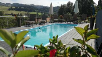 Seasonal outdoor pool, pool umbrellas, sun loungers