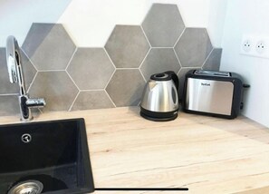 Fridge, stovetop, electric kettle, toaster