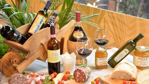 A variety of food and drink items including cheeses, meats, and bottles of wine, arranged on a table. - Two-room Apartment for 3 People With Kitchen and Private Bathroom (Arezzo)