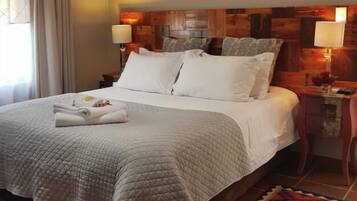 Double Room, Garden View | Minibar, individually furnished, desk, laptop workspace