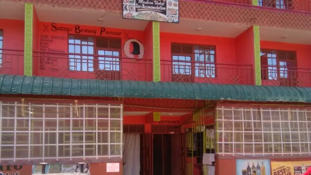 A multi-story building with a sign for 'Veroanto Modern Hotel Gas Accommodation'. - Veroanto Hotel (Siaya)