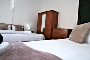 Sublime Brown Bedroom With Balcony | Desk, blackout drapes, iron/ironing board, free WiFi