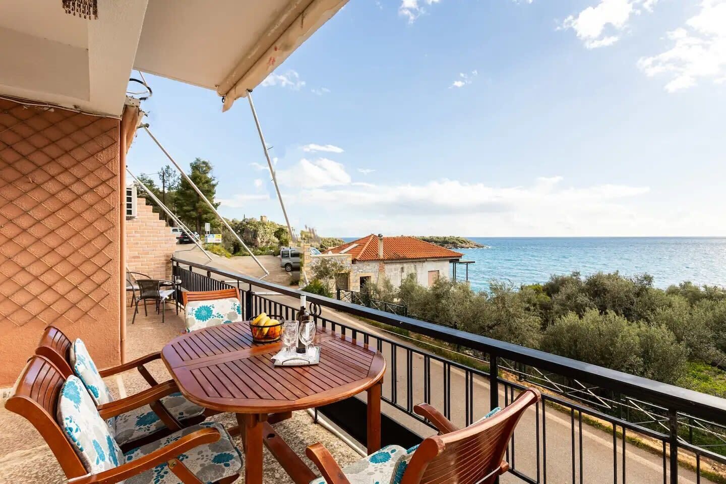 Balcony View – Overlooking the sea and lush surroundings.