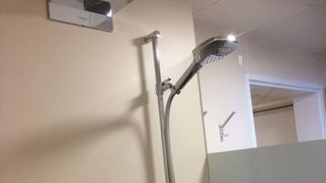 Bathtub, hair dryer, towels, soap