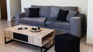 Apartment, 1 Bedroom | Living room | Flat-screen TV