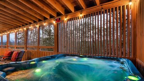 A hot tub with a wooden deck and a 'No Smoking' sign. - WHEELCHAIR ACCESSIBLE, 4 King Suites, Close to Pigeon Forge, WOW Views! (Sevierville)