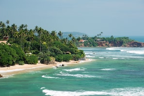 Beach nearby, white sand, beach cabanas, sun-loungers