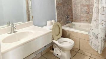 Room, 1 Queen Bed, Non Smoking | Bathroom | Combined shower/bathtub, free toiletries, hair dryer, towels
