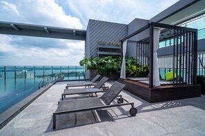 Outdoor pool, open 7:00 AM to 8:00 PM, pool loungers