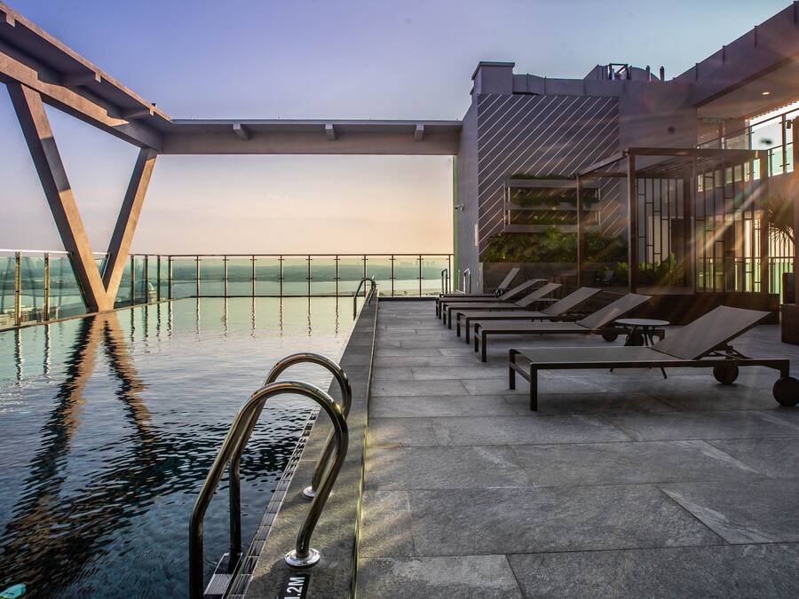 Outdoor pool, open 7:00 AM to 8:00 PM, pool loungers