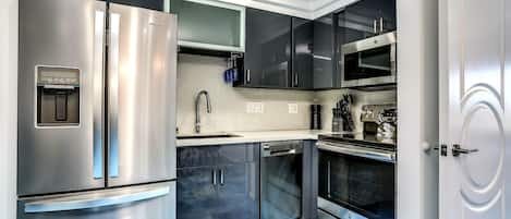 Microwave, dishwasher, coffee/tea maker, cookware/dishes/utensils