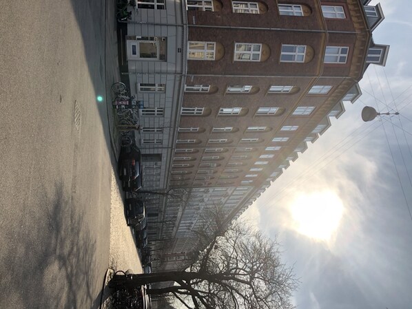 Stylish building with a traditional grid-patterned facade and balconies.