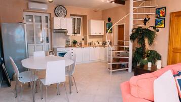 Villa | Living area | 40-inch flat-screen TV with cable channels, TV