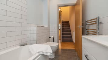 Combined shower/bathtub, hair dryer, towels, soap