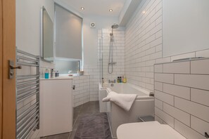 Combined shower/tub, hair dryer, towels, soap