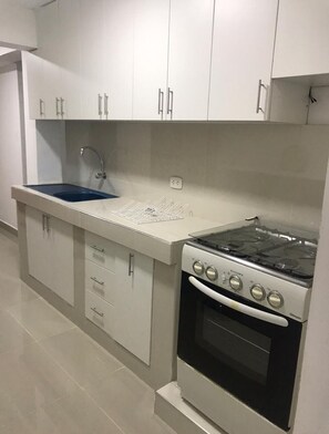 Fridge, microwave, cookware/dishes/utensils