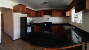 Fridge, microwave, stovetop, cookware/dishes/utensils - Mary's Lodge (San Juan)