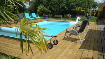 Alberca al aire libre y alberca climatizada