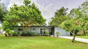 A single-story house with a front yard, a small tree, and a pathway leading to the entrance. - 'Uncle Louie's' Gulf Coast Gem w/ Outdoor Oasis (Bradenton)