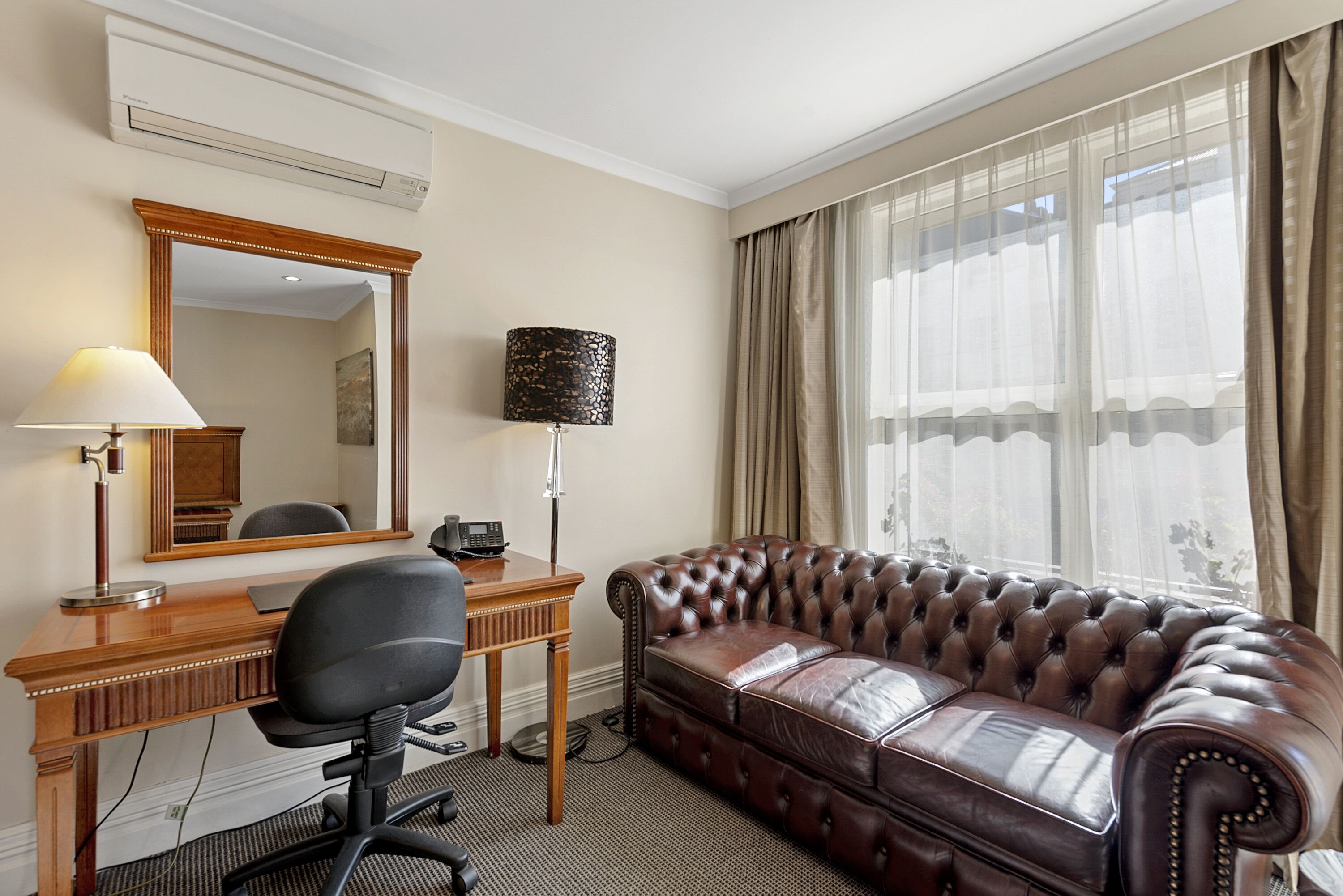 deluxe twin room | in-room safe, desk, laptop workspace, blackout curtains