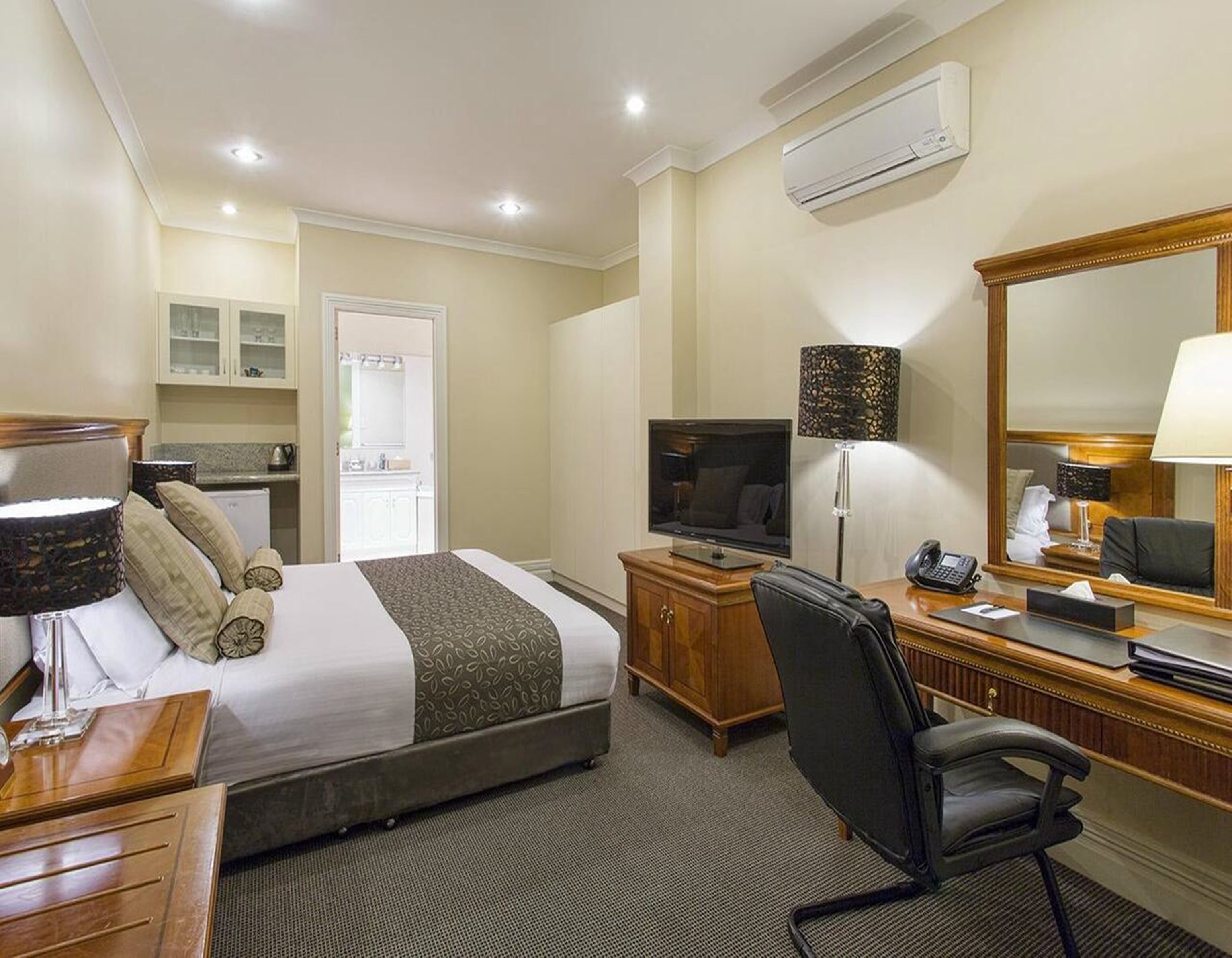 deluxe queen room | in-room safe, desk, laptop workspace, blackout curtains