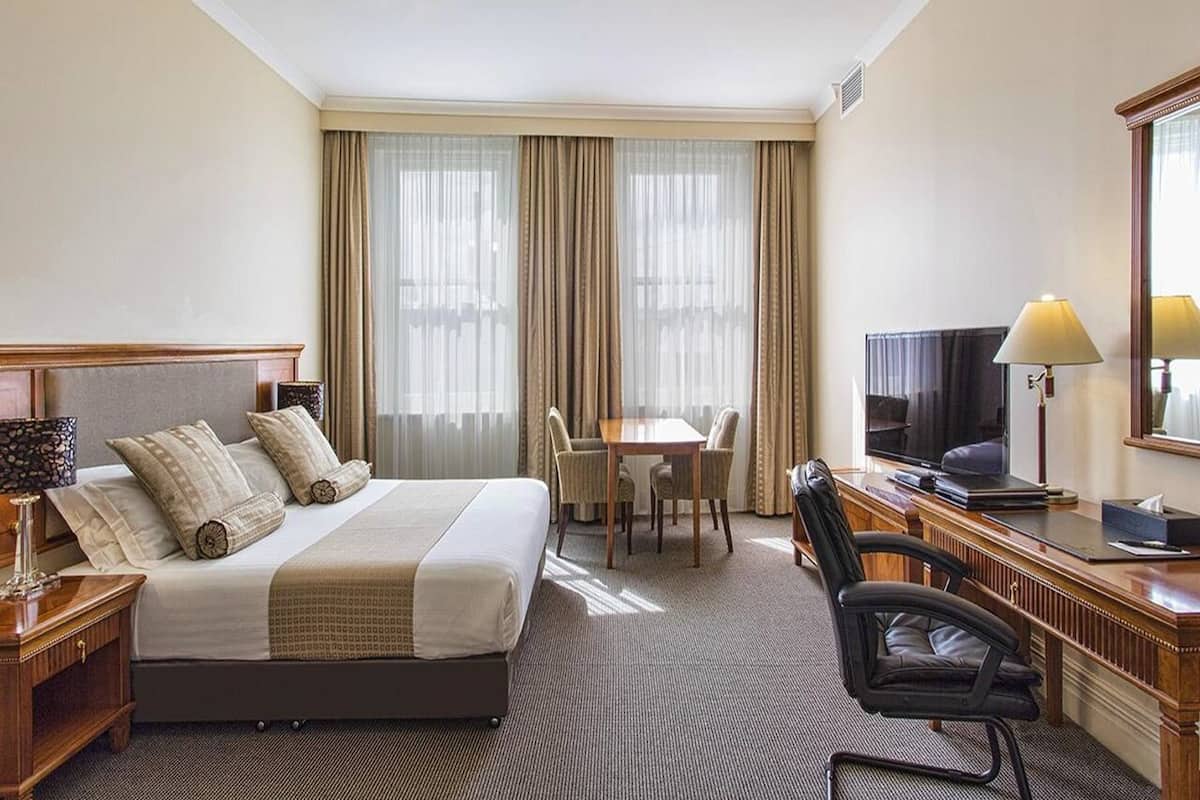 deluxe queen room | in-room safe, desk, laptop workspace, blackout curtains