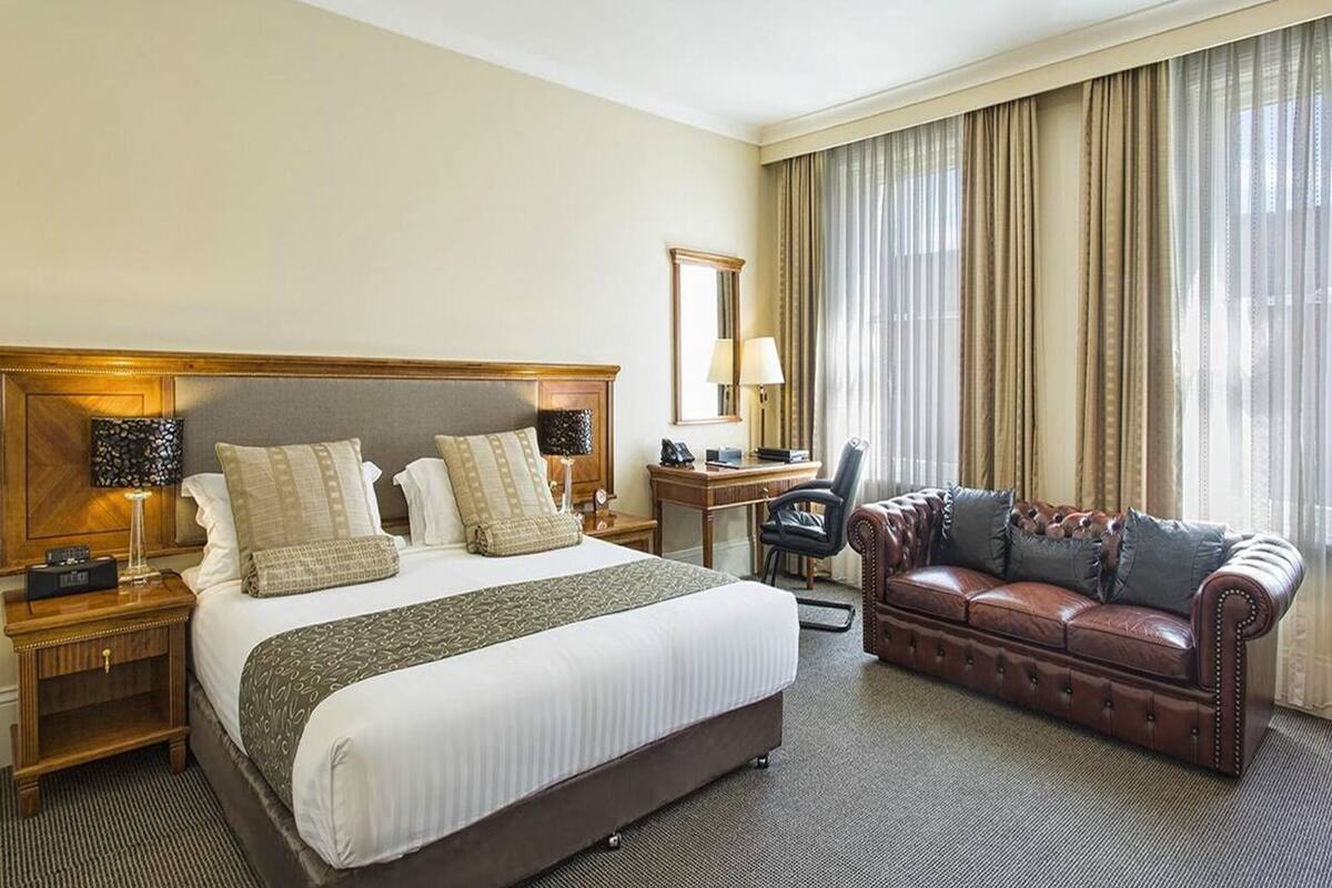 deluxe spa room | in-room safe, desk, laptop workspace, blackout curtains