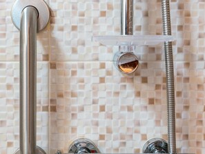 Bathtub, eco-friendly toiletries, hair dryer, towels