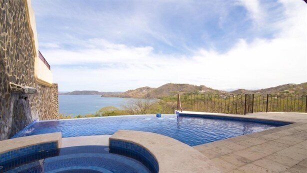 A swimming pool with a view of the sea and hills. - Mariners Point - C1 (Sardinal)