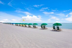 On the beach, sun loungers, beach towels