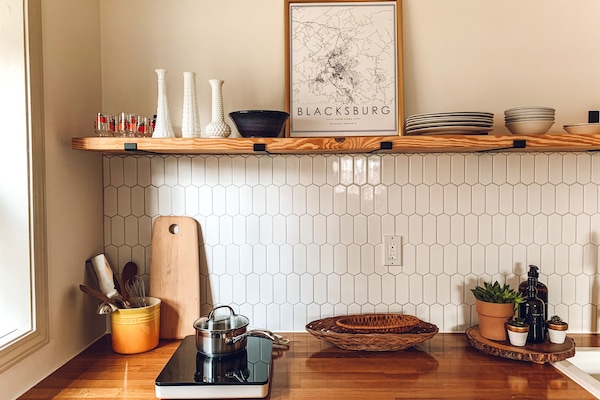 Kitchen with a cooktop, microwave, coffee pot, nespresso maker, toaster oven