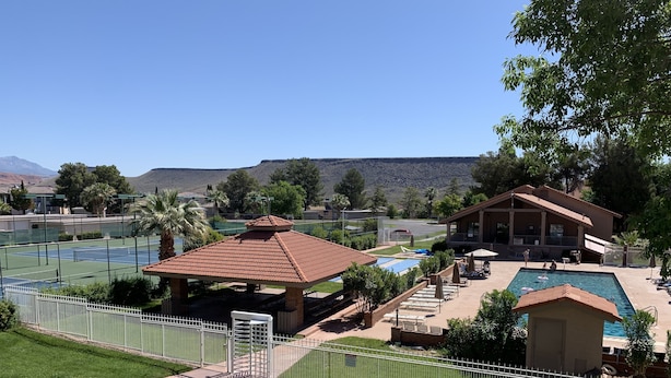 A resort with a tennis court, a pool area, and a gazebo. - Cozy Sports Village Condo 1 BD 1 BA - Newly Remodeled! (St. George)
